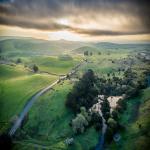 Sunrises Behind Hills of Green Spring