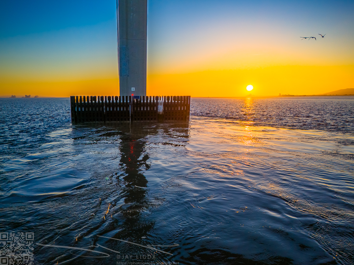 Sunrise Behind Bridge Pier