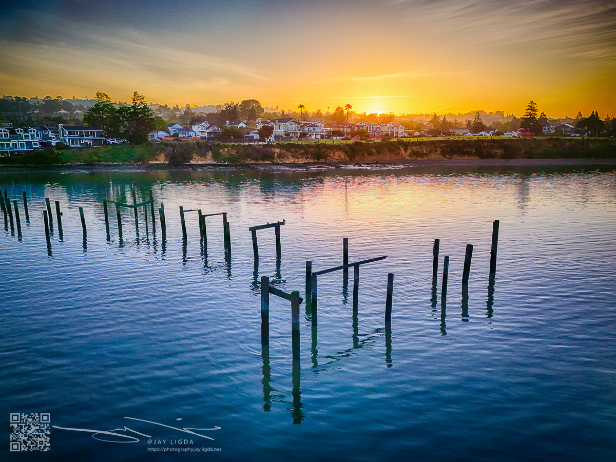 Sunrise on the Strait Behind Abandoned Piers