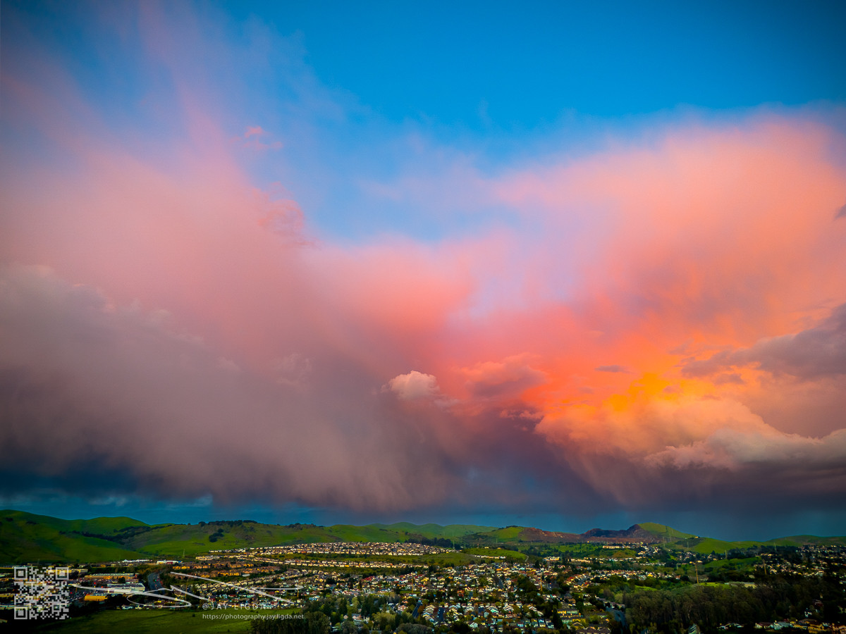 Cotton Candy Pink Clouds Illuminated Above Green Hills Cotton Candy Pink Clouds Illuminated Above Green Hills