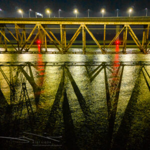 Criss Cross Bridge Truss Shadows at Night