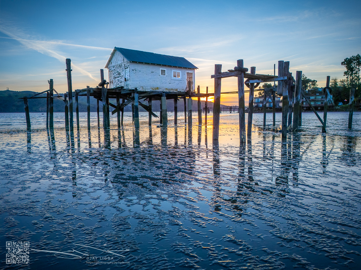 Boathouse on Stilts at Low Tide