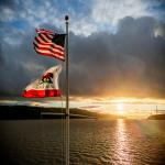 Flags Blowing in Wind at Sunset