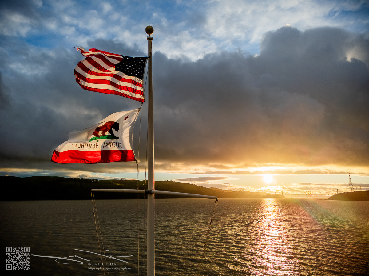 Flags Blowing in Wind at Sunset