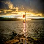 Firey Sunset Behind Flags