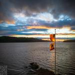 Sunset Beyond Blowing Flags