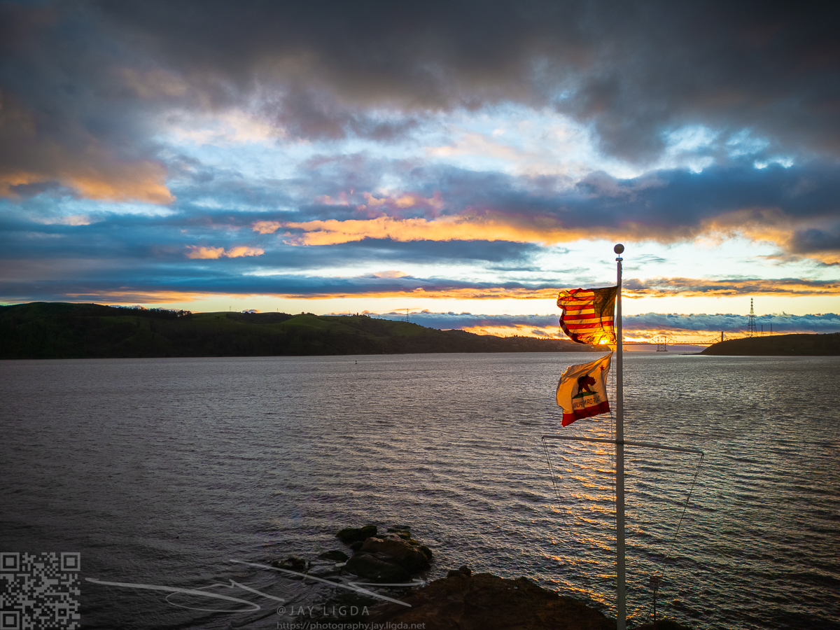 Sunset Beyond Blowing Flags