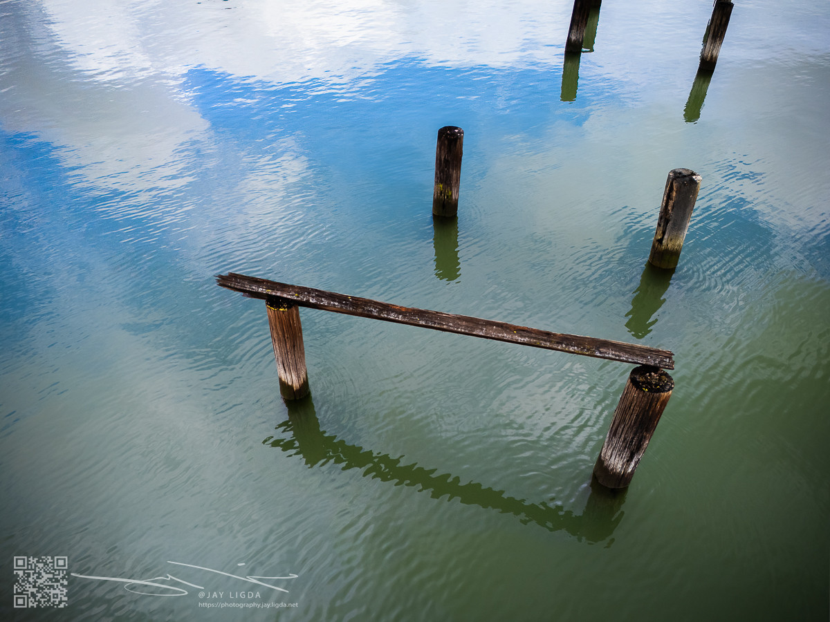 Blue Sky Reflects Calm Waters and Piers Blue Sky Reflects Calm Waters and Piers