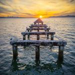Sun Sets at the End of a Dilapidated Pier Sun Sets at the End of a Dilapidated Pier