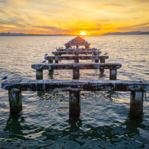 Sun Sets at the End of a Dilapidated Pier