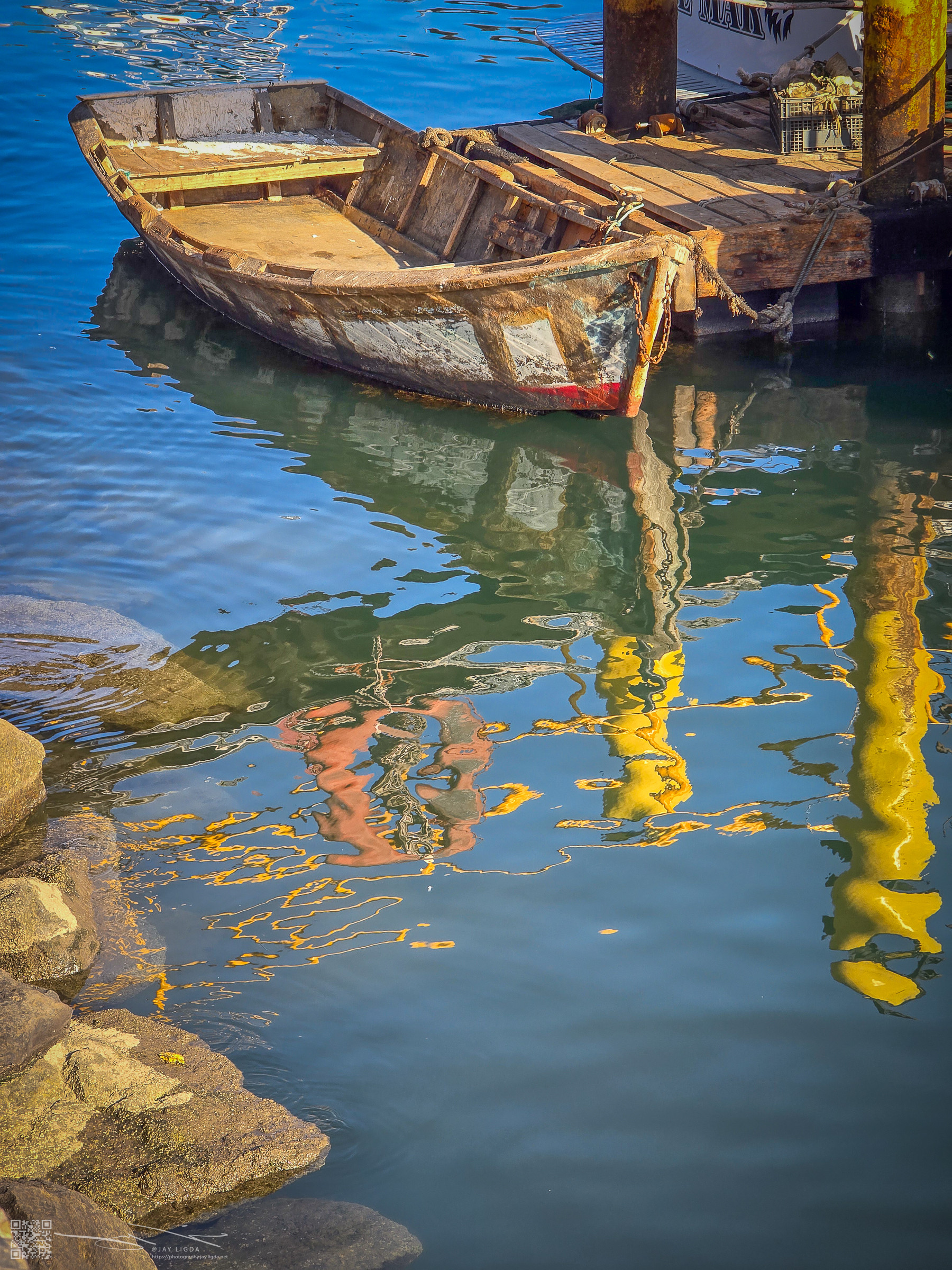 Old Rowboat and Water Reflections