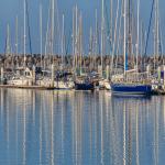 Masts Reflect in Calm Waters