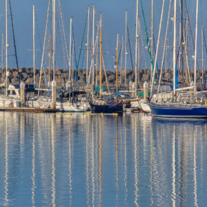 Masts Reflect in Calm Waters
